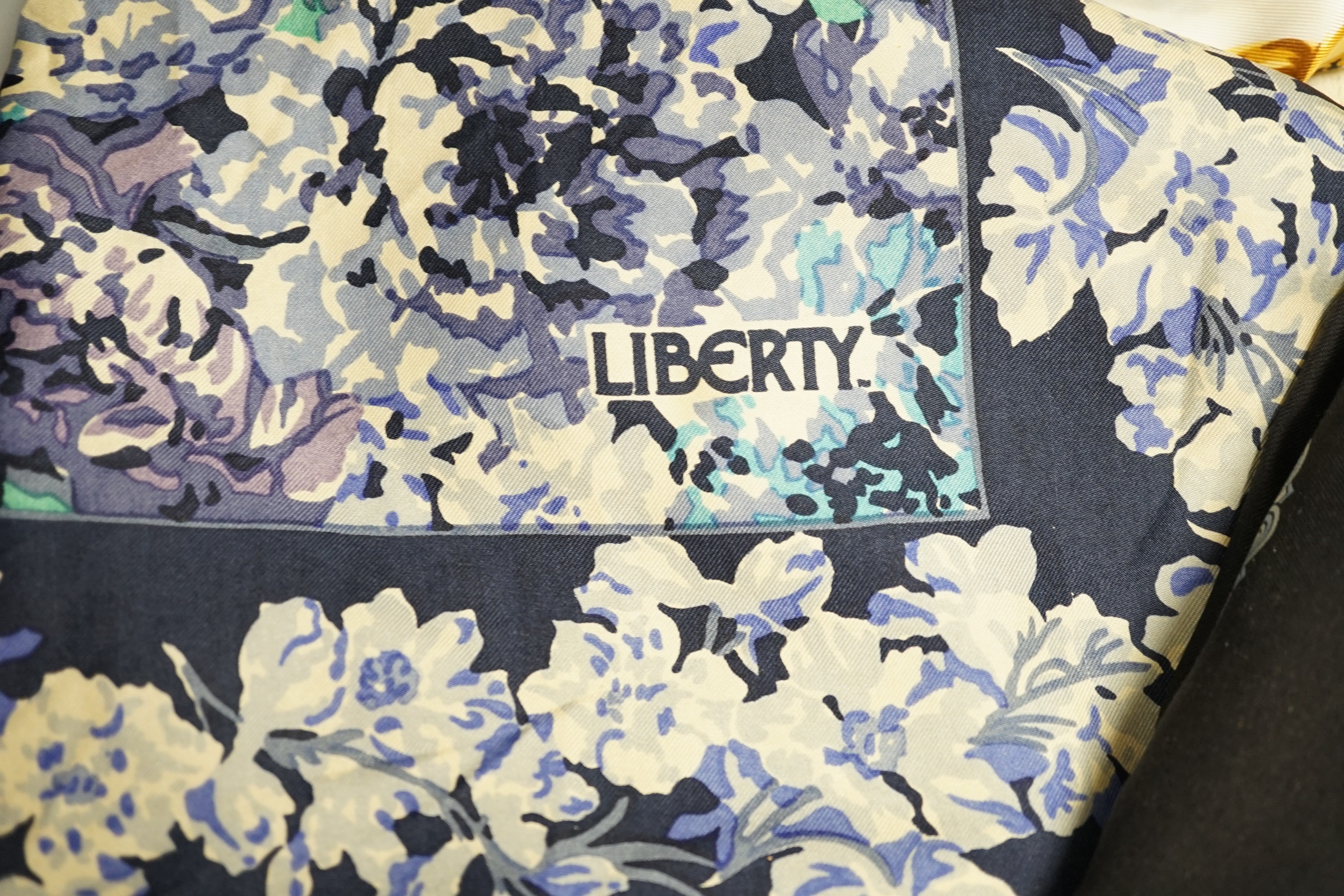 Eleven silk and other scarves